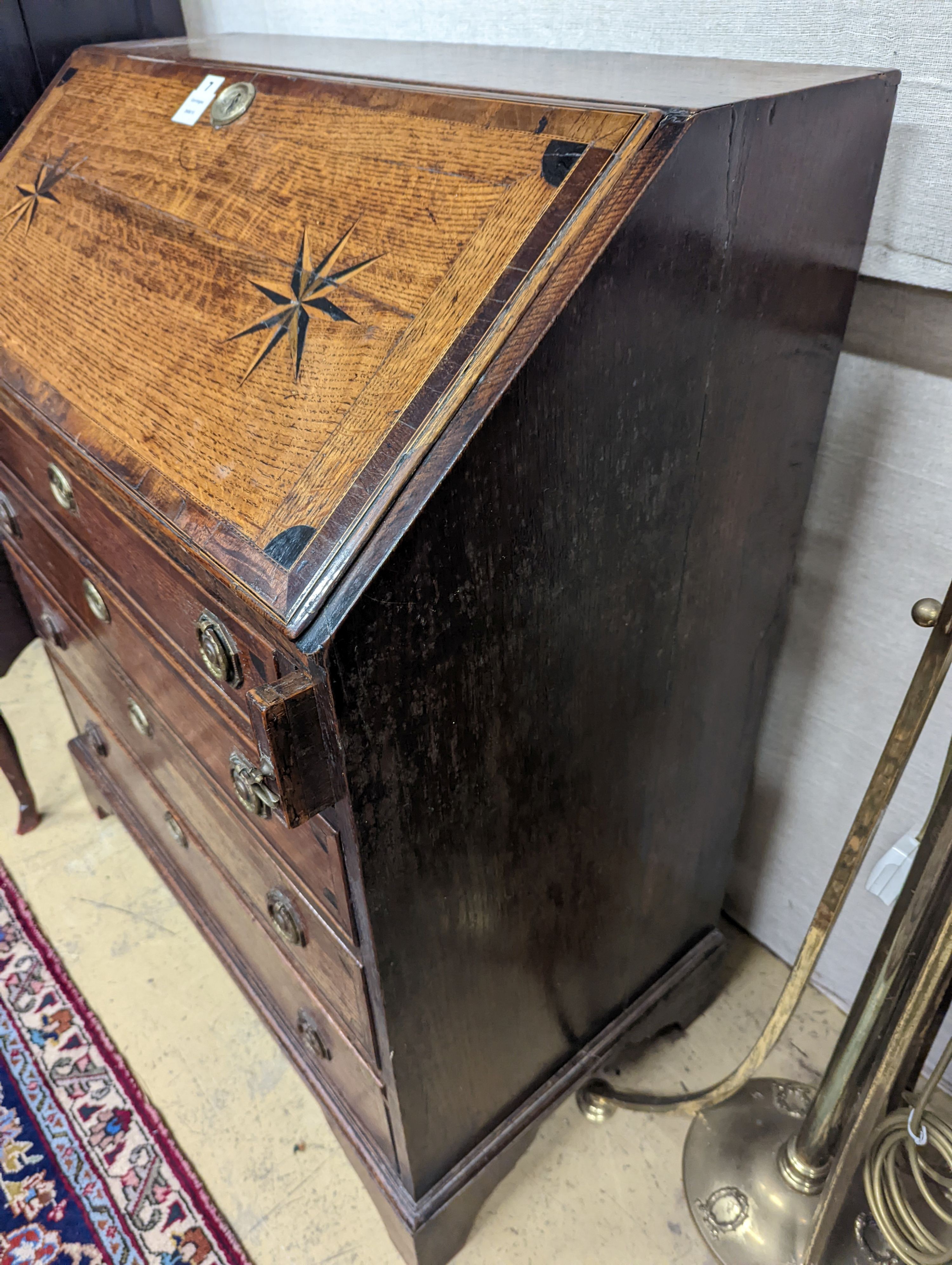 A George III inlaid oak bureau, width 85cm, depth 47cm, height 101cm